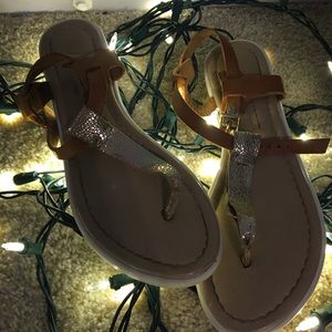 Gold and tan flip flops